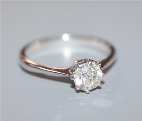 An 18ct white metal and solitaire diamond ring, size M.